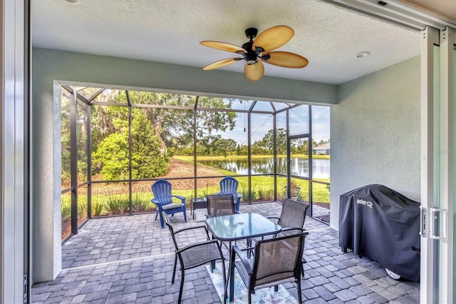2628 Sapphire Blue Ln, Bradenton, FL 34211 - sunroom with a water view and a ceiling fan