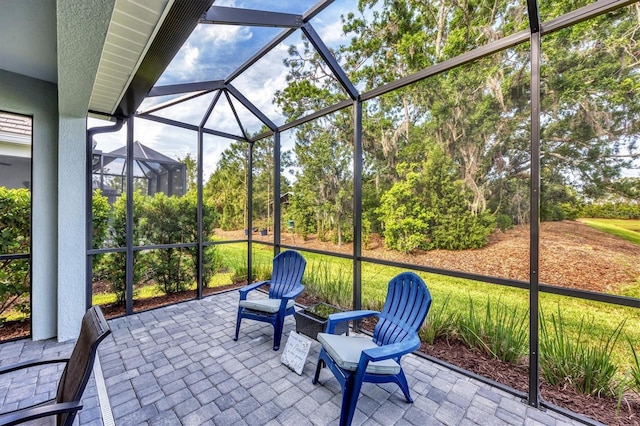2628 Sapphire Blue Ln, Bradenton, FL 34211 - sunroom / solarium with view of wooded area