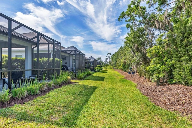 2628 Sapphire Blue Ln, Bradenton, FL 34211 - view of green lawn with glass enclosure