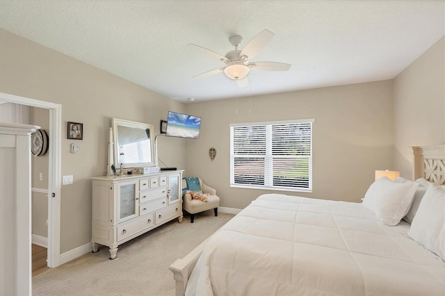 2628 Sapphire Blue Ln, Bradenton, FL 34211 - bedroom featuring light colored carpet, baseboards, and ceiling fan