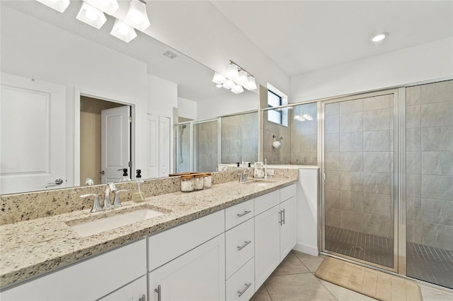 5406 Coral Reef Way, Lakewood Ranch, FL 34211 - bathroom with double vanity, a stall shower, and tile patterned flooring