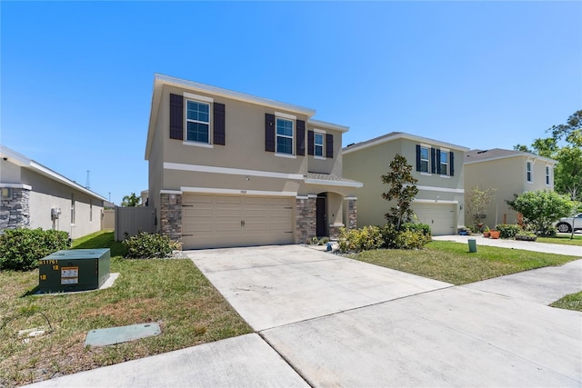 view of front facade with a front yard, stone siding, concrete driveway, stucco siding, and an attached garage