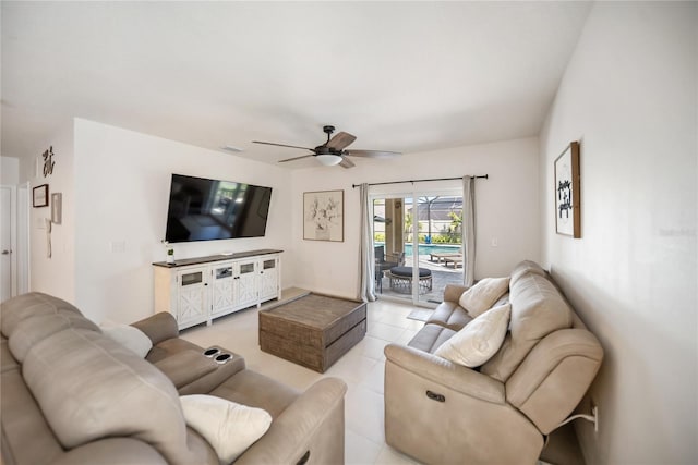 living area featuring ceiling fan and light tile patterned floors