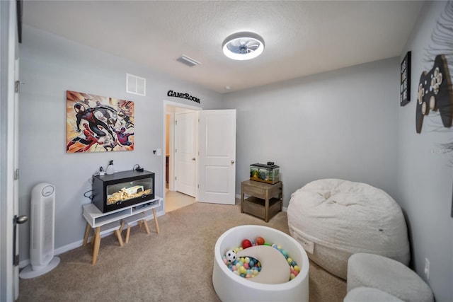 game room featuring carpet, baseboards, and visible vents