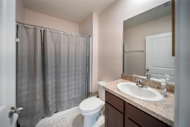 bathroom featuring curtained shower, visible vents, toilet, and vanity