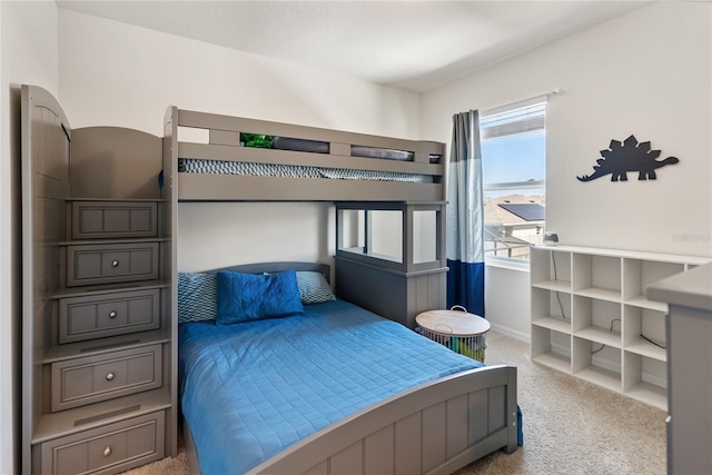 carpeted bedroom with baseboards