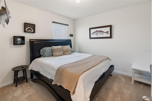carpeted bedroom featuring baseboards