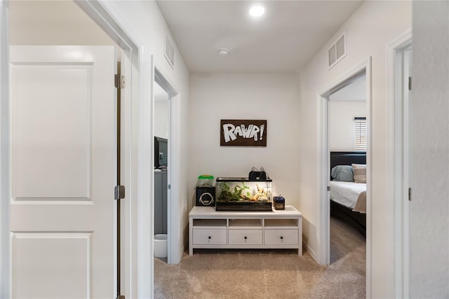 corridor featuring visible vents and carpet
