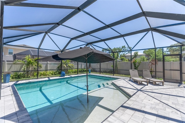 view of swimming pool featuring a fenced backyard, a lanai, a patio, and a fenced in pool