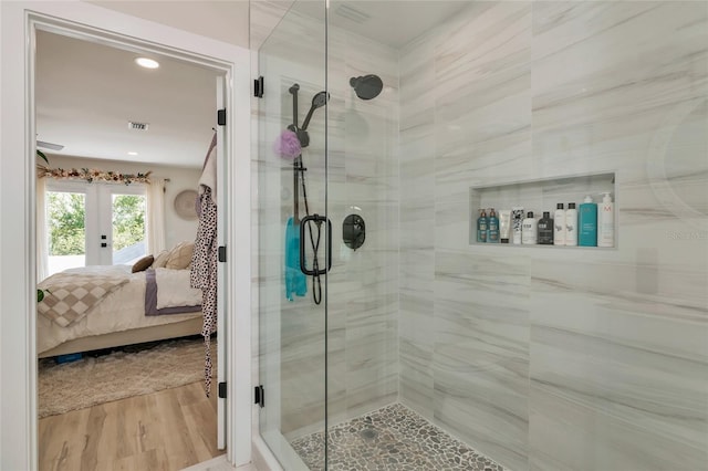 1208 Oak Hammock Rd, Sarasota, FL 34240 - bathroom with connected bathroom, french doors, a shower stall, wood finished floors, and recessed lighting
