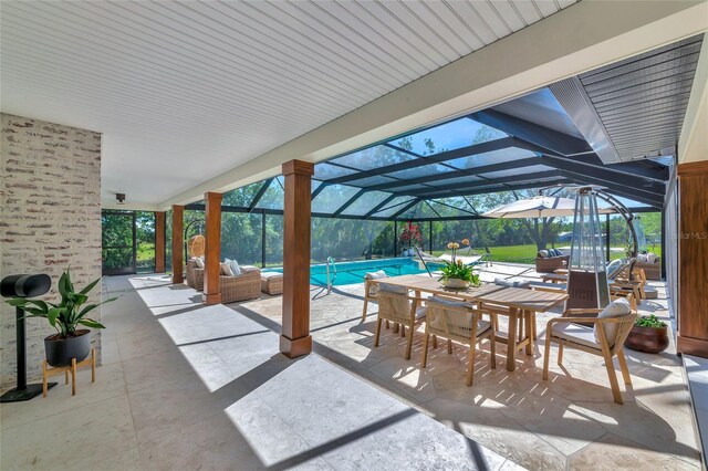 1208 Oak Hammock Rd, Sarasota, FL 34240 - view of patio with outdoor dining space, an outdoor pool, and glass enclosure