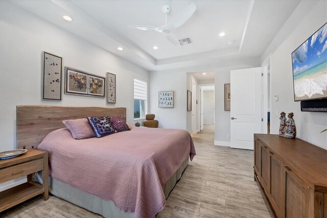 17675 Azul Dr, Lakewood Ranch, FL 34202 - bedroom with light wood-style floors, ceiling fan, visible vents, recessed lighting, and a raised ceiling