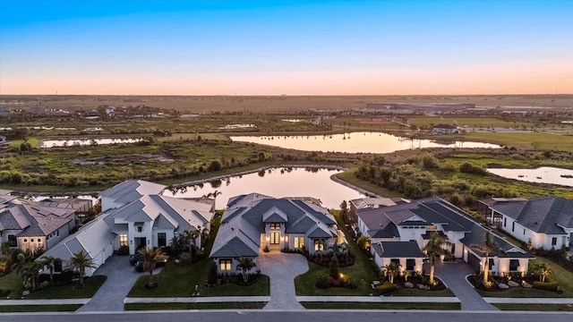 9241 Starry Night Ave, Sarasota, FL 34241 - aerial view at dusk featuring a residential view and a water view