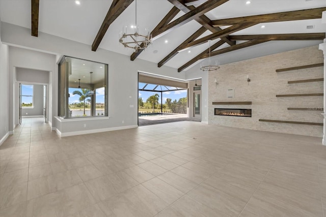 9241 Starry Night Ave, Sarasota, FL 34241 - unfurnished living room featuring high vaulted ceiling, beamed ceiling, baseboards, recessed lighting, and a notable chandelier