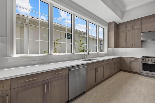 9241 Starry Night Ave, Sarasota, FL 34241 - kitchen with a wealth of natural light, under cabinet range hood, a sink, and stainless steel appliances