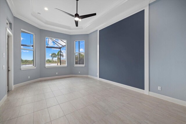 9241 Starry Night Ave, Sarasota, FL 34241 - unfurnished room featuring baseboards, ornamental molding, and a raised ceiling