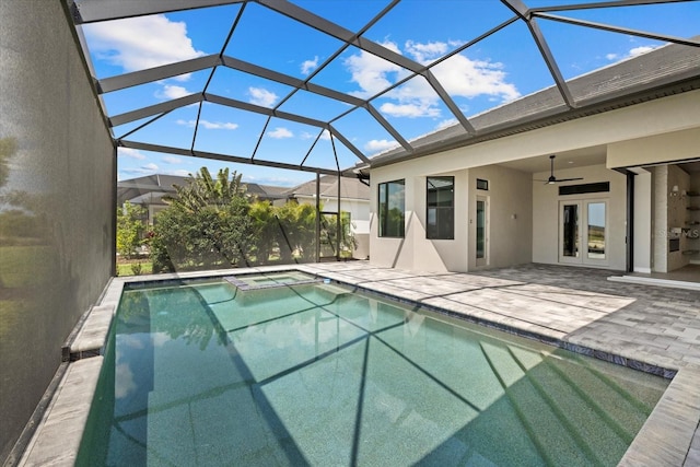 9241 Starry Night Ave, Sarasota, FL 34241 - pool featuring a hot tub, french doors, glass enclosure, ceiling fan, and a patio area