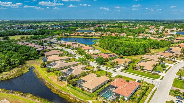 bird's eye view featuring a residential view and a water view