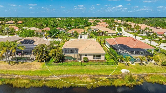 bird's eye view featuring a water view and a residential view