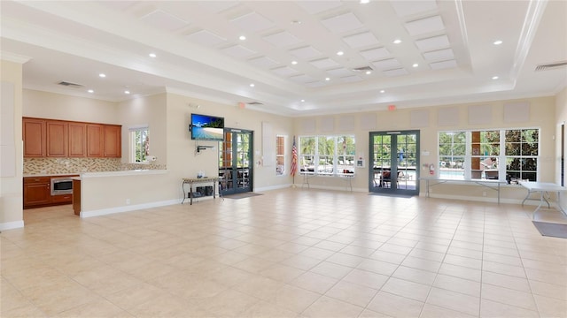 unfurnished living room featuring light tile patterned flooring, baseboards, visible vents, and crown molding
