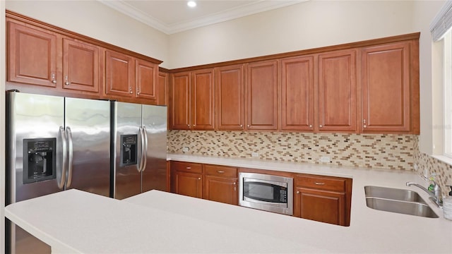 kitchen with light countertops, a sink, stainless steel appliances, and backsplash