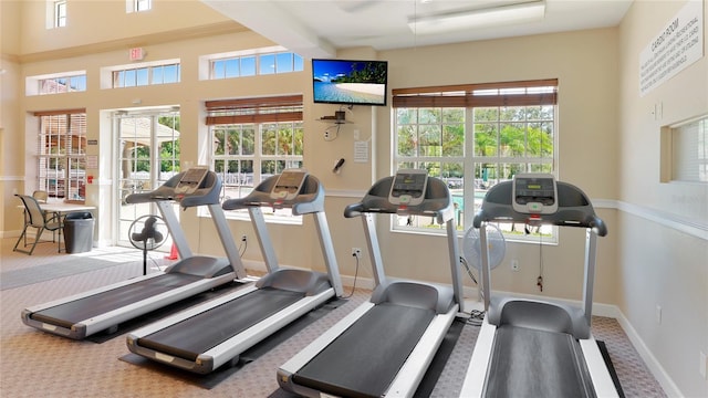 workout area with a wealth of natural light and baseboards