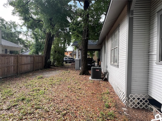 1002 E Ida St, Tampa, FL 33603 - view of yard featuring central air condition unit and fence