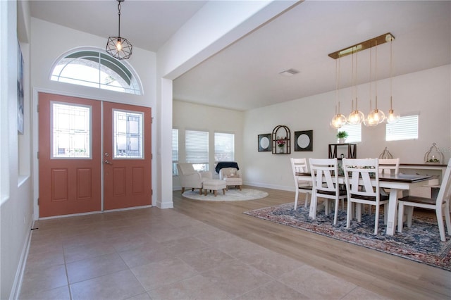 12841 Balsam Ter, Bradenton, FL 34212 - foyer with baseboards, light wood-style flooring, and a chandelier