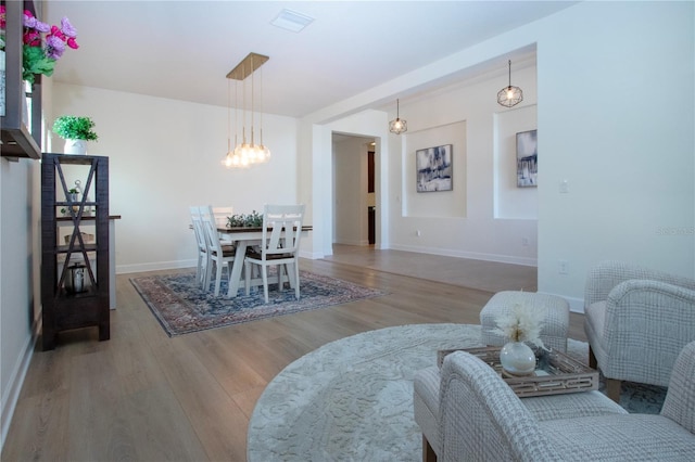 12841 Balsam Ter, Bradenton, FL 34212 - dining space featuring wood finished floors, a chandelier, and baseboards