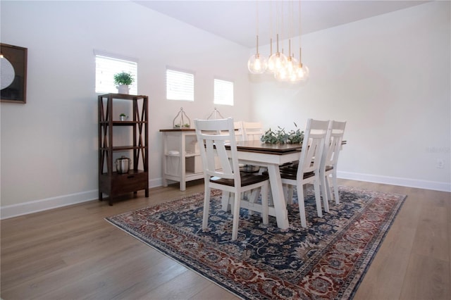 12841 Balsam Ter, Bradenton, FL 34212 - dining room with a chandelier, wood finished floors, and baseboards