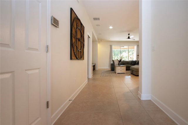 12841 Balsam Ter, Bradenton, FL 34212 - corridor featuring light tile patterned flooring, baseboards, and recessed lighting