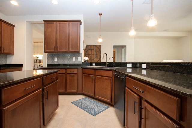 12841 Balsam Ter, Bradenton, FL 34212 - kitchen featuring dishwasher, tasteful backsplash, light tile patterned flooring, dark stone counters, and decorative light fixtures