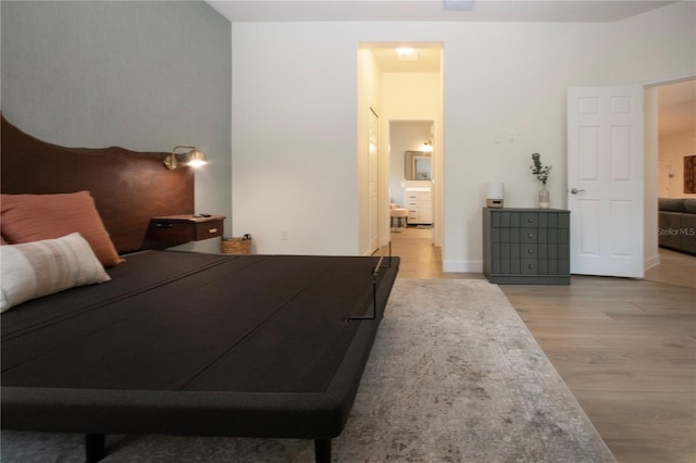 12841 Balsam Ter, Bradenton, FL 34212 - bedroom with wood finished floors and ensuite bathroom