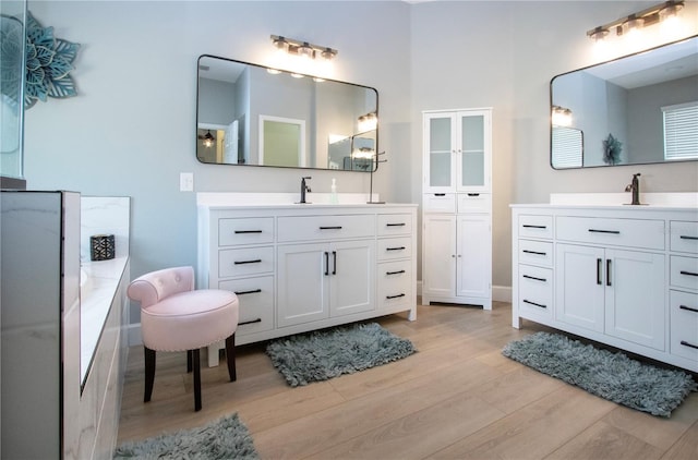 12841 Balsam Ter, Bradenton, FL 34212 - bathroom featuring wood finished floors and two vanities