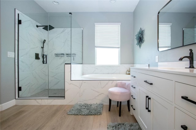 12841 Balsam Ter, Bradenton, FL 34212 - full bath with a garden tub, vanity, a marble finish shower, and wood finished floors