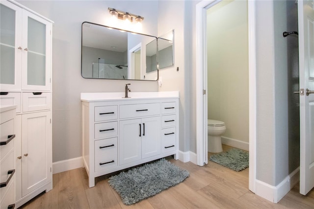 12841 Balsam Ter, Bradenton, FL 34212 - full bathroom featuring vanity, wood finished floors, and baseboards