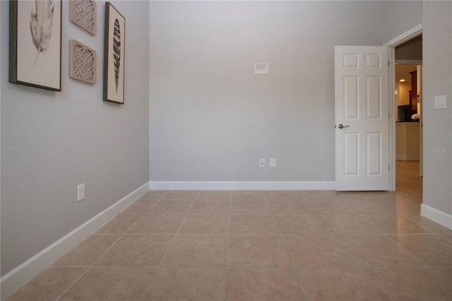 12841 Balsam Ter, Bradenton, FL 34212 - tiled empty room featuring baseboards