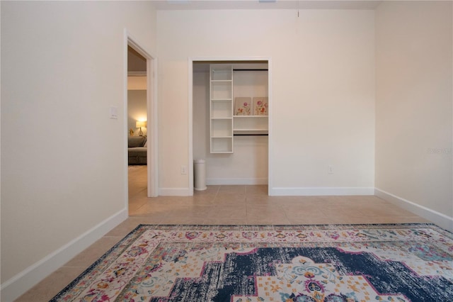 12841 Balsam Ter, Bradenton, FL 34212 - unfurnished bedroom featuring tile patterned flooring, baseboards, and a closet