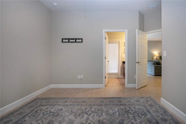 12841 Balsam Ter, Bradenton, FL 34212 - unfurnished bedroom featuring tile patterned floors and baseboards
