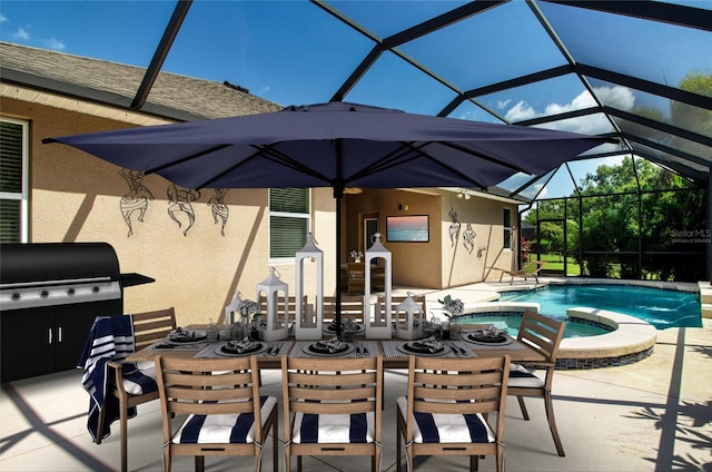12841 Balsam Ter, Bradenton, FL 34212 - view of pool with a patio, glass enclosure, a pool with connected hot tub, outdoor dining area, and area for grilling