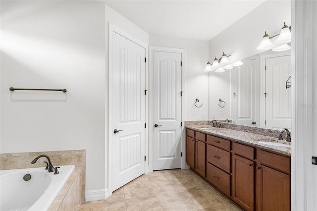 full bath featuring a sink, a bath, double vanity, and tile patterned flooring