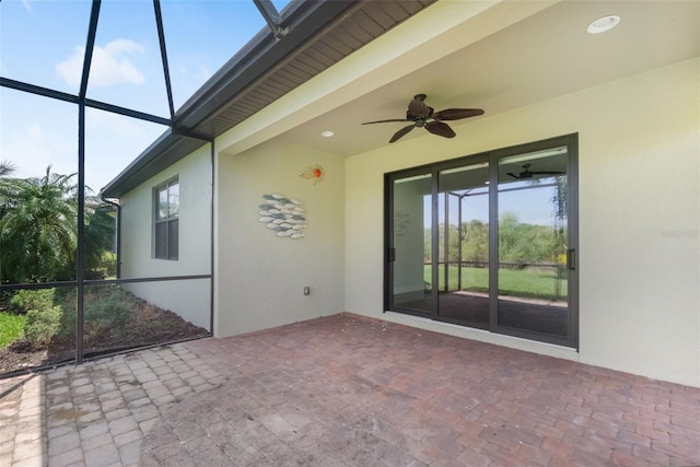 view of patio / terrace with a lanai and ceiling fan