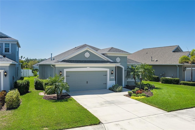 11021 Blue Magnolia Ln, Parrish, FL 34219 - view of front of home featuring stucco siding, a garage, concrete driveway, and a front yard