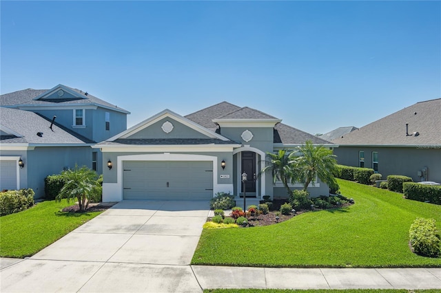 11021 Blue Magnolia Ln, Parrish, FL 34219 - view of front of property featuring a front lawn, a garage, concrete driveway, and stucco siding