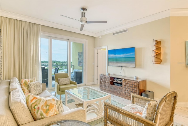 living area featuring light tile patterned flooring, a ceiling fan, baseboards, visible vents, and ornamental molding