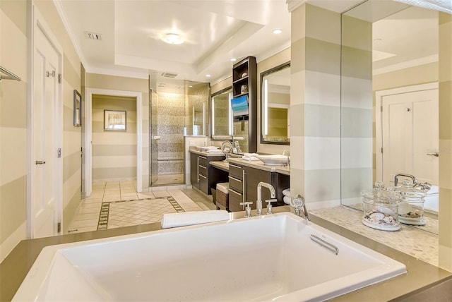full bathroom with a tray ceiling, a stall shower, vanity, tile patterned flooring, and visible vents