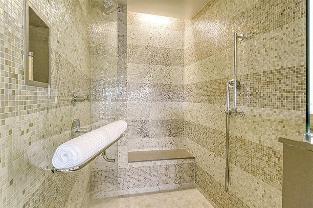 bathroom with a tile shower