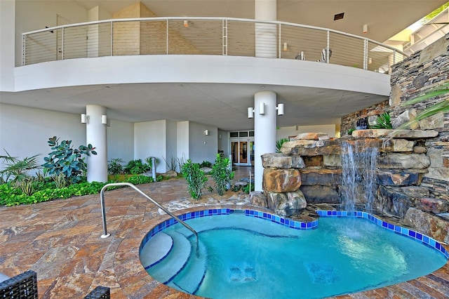 view of swimming pool with a patio