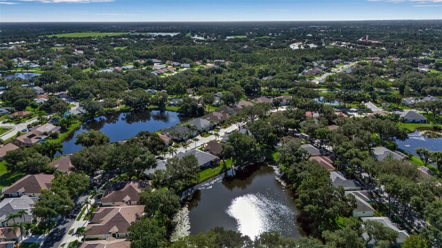 birds eye view of property featuring a residential view and a water view