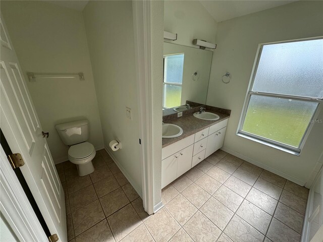 11811 53rd Ct E, Parrish, FL 34219 - bathroom featuring plenty of natural light, tile patterned floors, toilet, and a sink